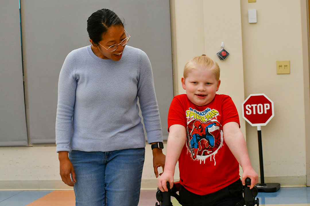 Female P.G. Chambers program participant working with a therapist on constructive play and mirroring activities